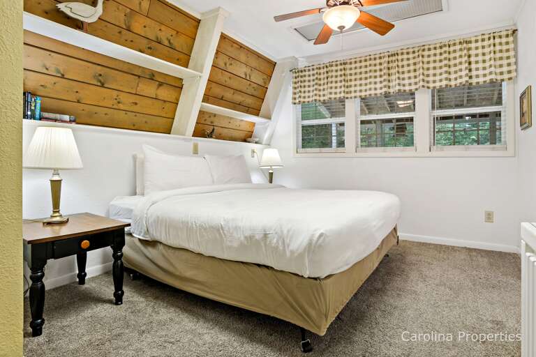 Down a hall from the living area is a king bed suite.