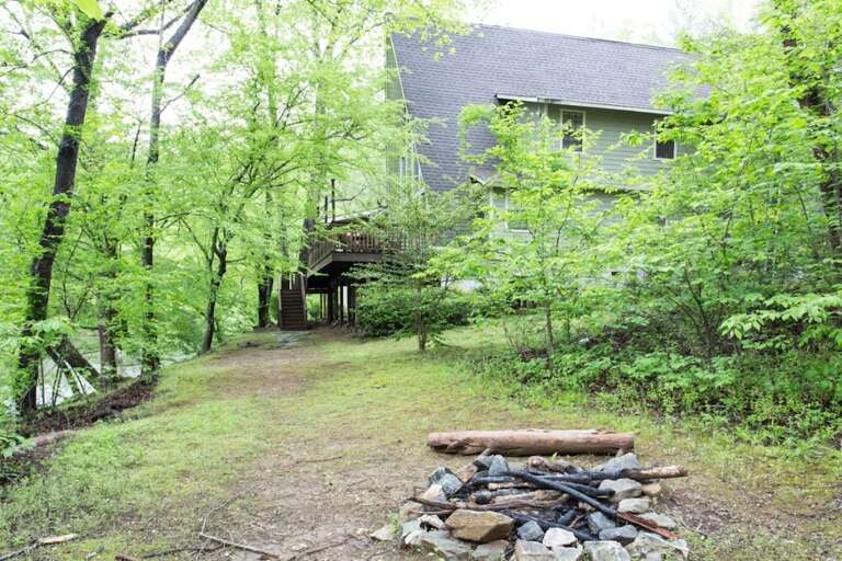 There is a large yard and fire pit. Plus, you have access to all of the amenities of the Riverbend at Lake Lure community including Mirror Lake.