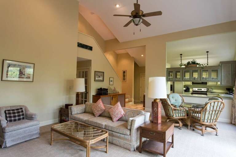 Past the dining area is the living area with comfortable furniture and a TV. Past the dining area is the living area with comfortable furniture and a TV.