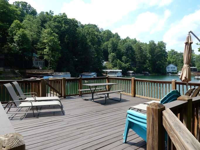 The boat house deck is a great place for sun, relaxation, meals, and for watching the lake activity.