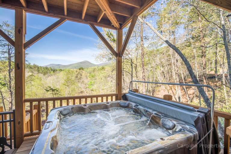 Hot tub on lower level deck overlooking the mountains