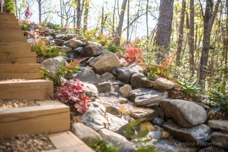 Stunning man-made waterfall feature creates a relaxing atmosphere Stunning man-made waterfall feature creates a relaxing atmosphere
