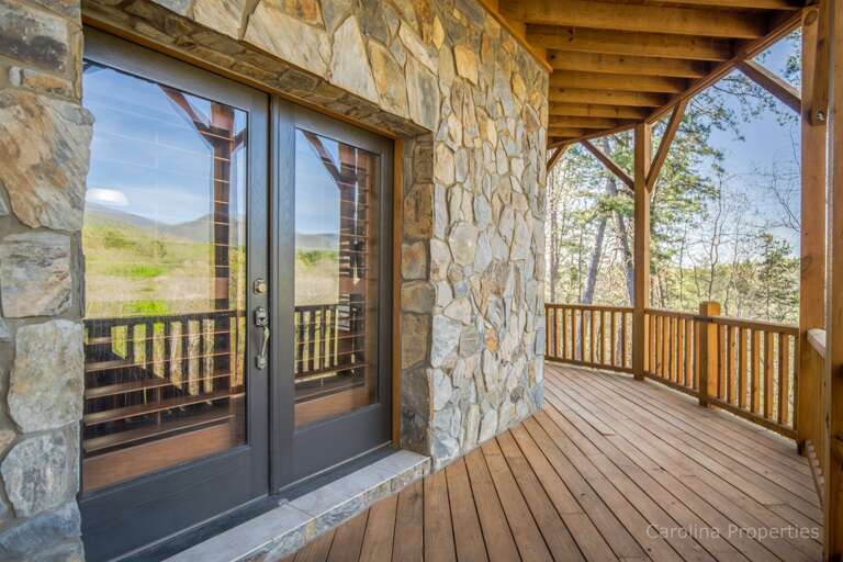 Beautiful sliding glass doors encased in stone on lower level Beautiful sliding glass doors encased in stone on lower level