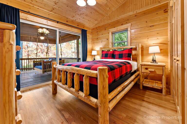 Additional view of bedroom with queen size bed and sliding door to outside