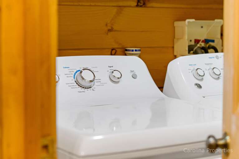 Full size washer and dryer off the kitchen