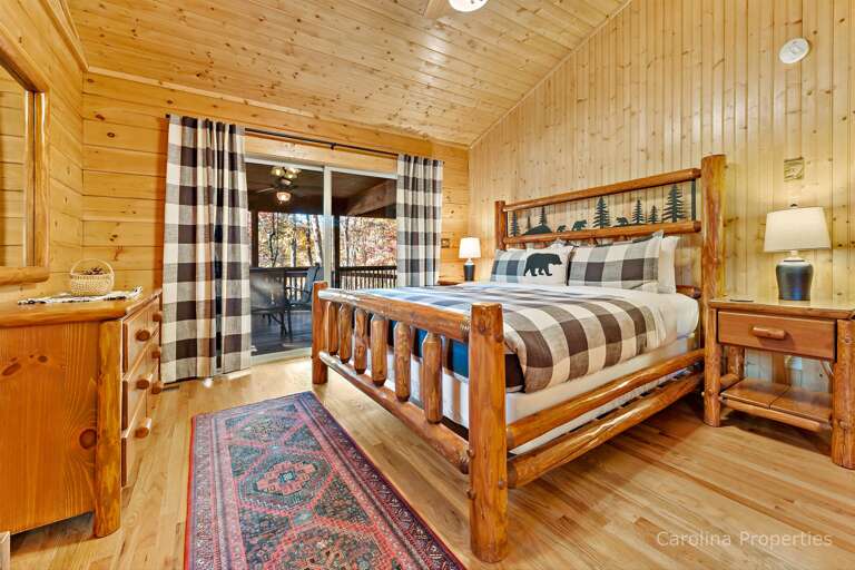 King bedroom suite with sliding door to the porch