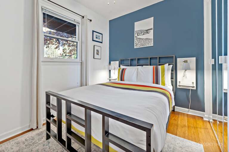 Lower-level bedroom with full size bed