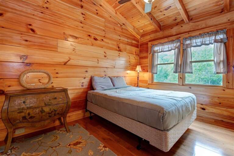 Upper level bedroom 2 with queen bed Upper level bedroom 2 with queen bed