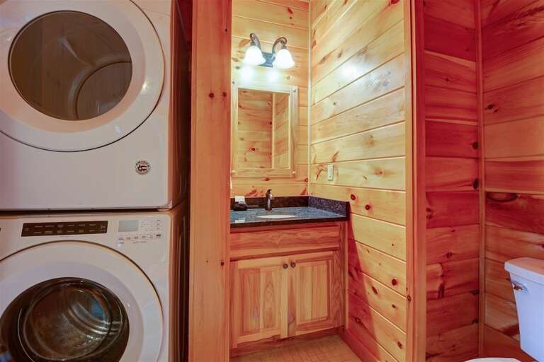 Stack washer/dryer and half bath on main level Stack washer/dryer and half bath on main level