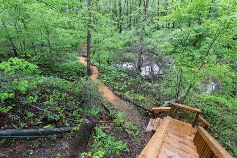 Take the stairs and path to reach the river. Take the stairs and path to reach the river.