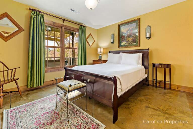 Lower-level bedroom with queen bed