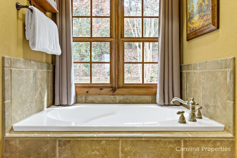 Large garden tub with a view in the main level master