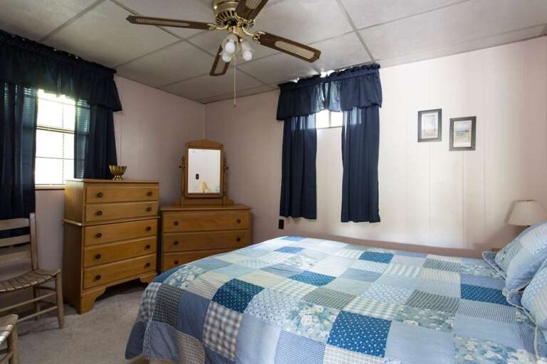 The bedroom on this level has a queen bed.