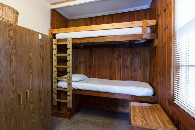 The twin bunk room has a window and wardrobe, located in 4th bedroom..