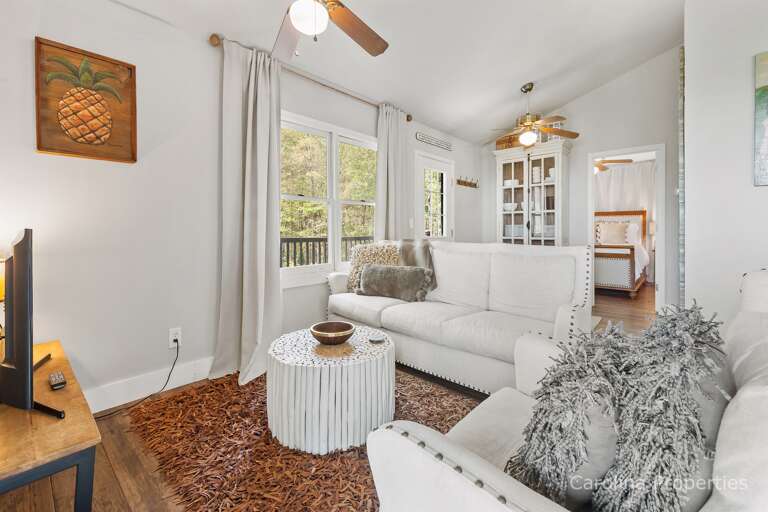 Additional view of living room with enough space for 4