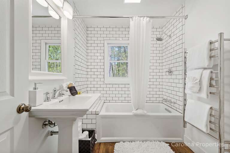 Full bathroom with combination shower and bathtub