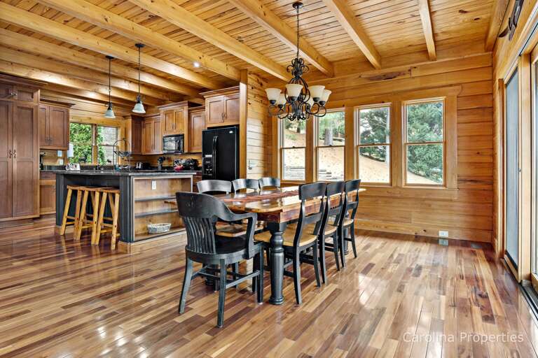 Large dining table near the open concept kitchen