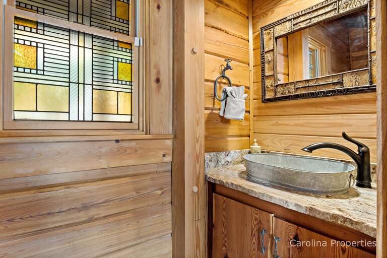 Upstairs half bathroom near the kitchen
