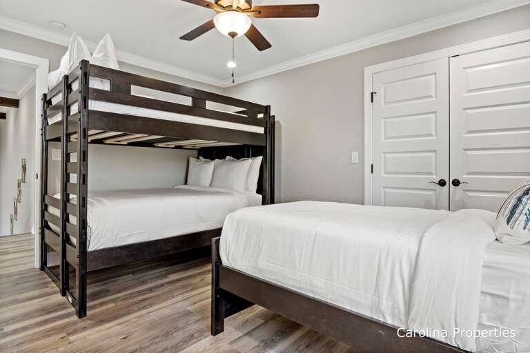 Upstairs bedroom with twin bed and full size bunk beds