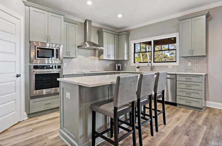 Stainless steel appliances and flat top stove with hood