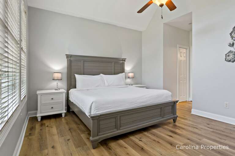 Additional view of main level master bedroom with king size bed