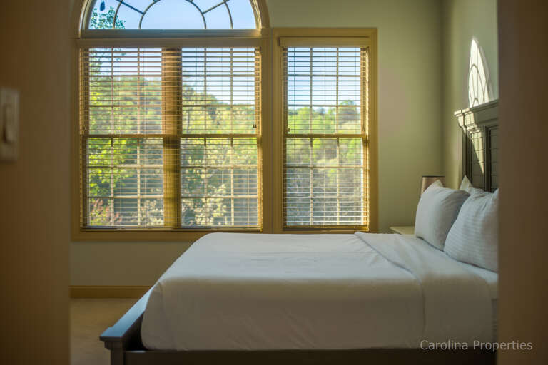 Additional view of main level master bedroom with king size bed Additional view of main level master bedroom with king size bed