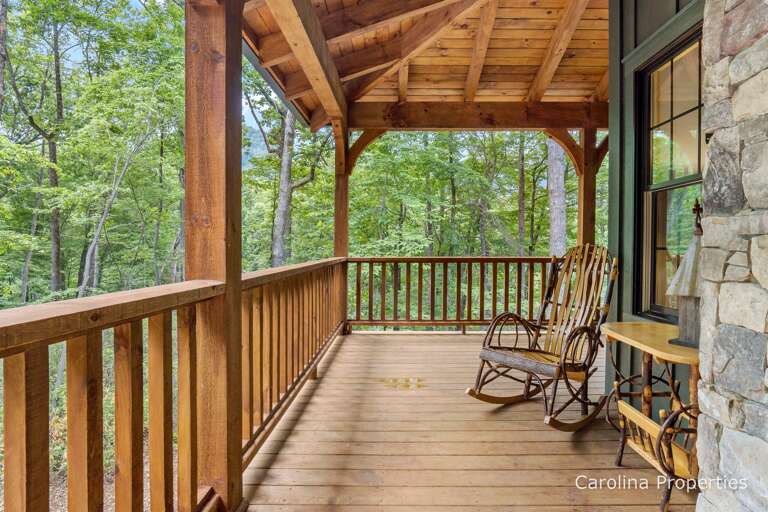 Covered deck with attractive decor and furniture