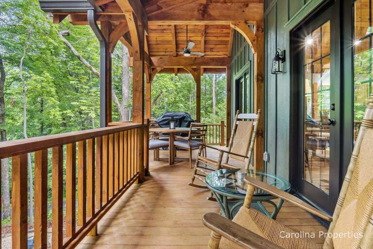 Covered deck with attractive decor and furniture