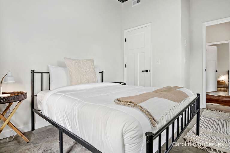 Queen bed in the lower level bedroom