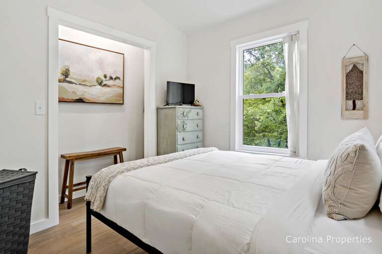 TV and dresser in the main level bedroom