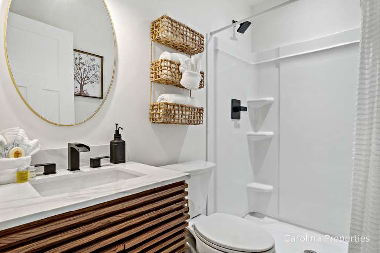 Main level full bathroom attached to the bedroom