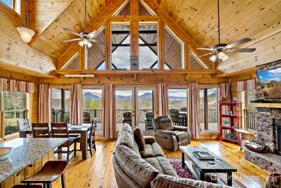 Cozy Bear Lodge features a large open concept living plan with shared space for the Kitchen, Living, and Dining Rooms