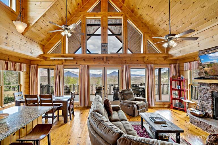 Cozy Bear Lodge features a large open concept living plan with shared space for the Kitchen, Living, and Dining Rooms