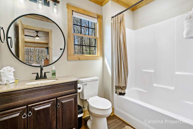 Upstairs en suite bathroom with shower and tub combination