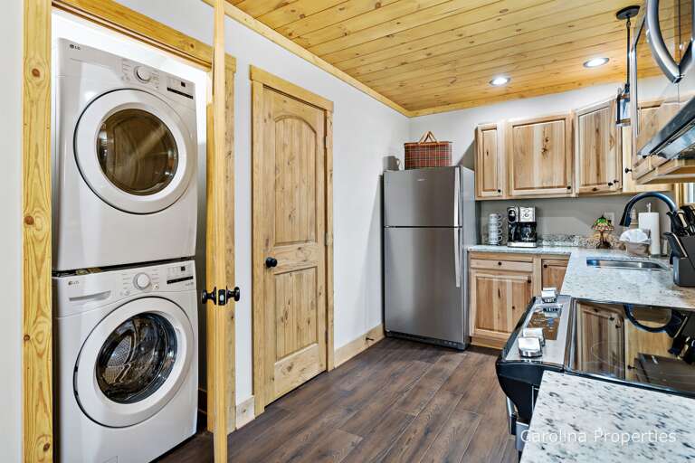 Full sized washer and dryer located in the kitchen