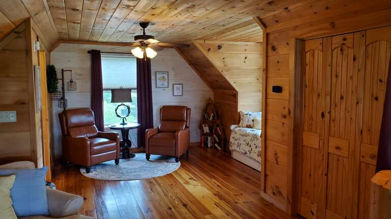 Loft area with a twin bed featuring a trundle Loft area with a twin bed featuring a trundle