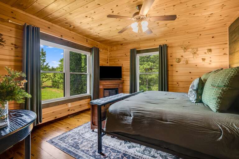 Large windows in the second bedroom on the main level.