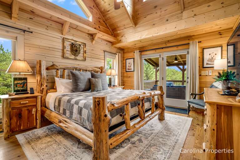 Main level master bedroom with a king size bed.