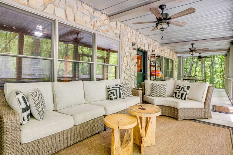 Cozy outdoor furniture on the screened in deck