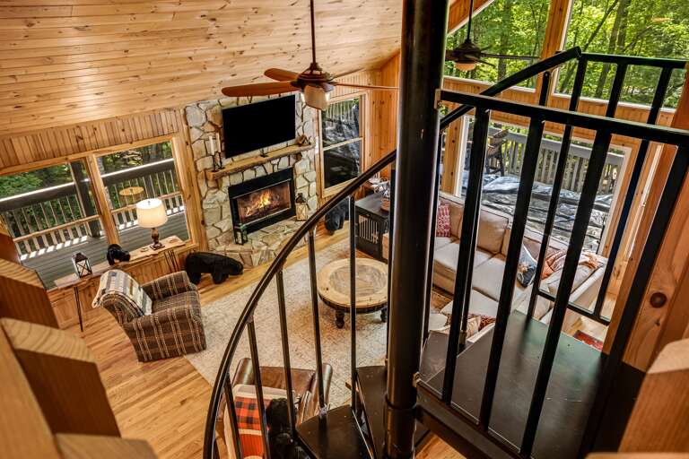 The spiral staircase leads up to the loft