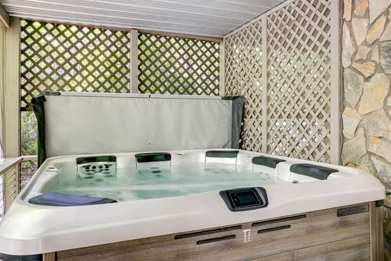 Hot tub located on the screened in deck