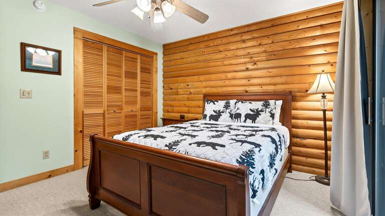 Across the hall you will find an additional bedroom with a queen bed