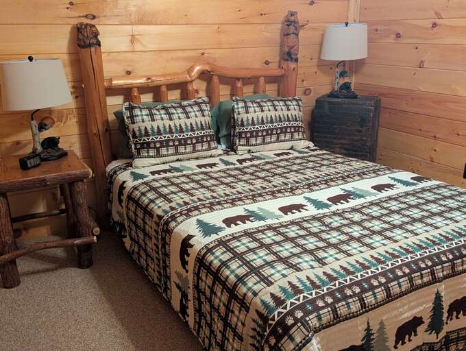 Lower level bedroom with queen bed