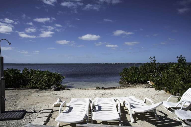 Beachside Lounge Chairs Facing The Sea