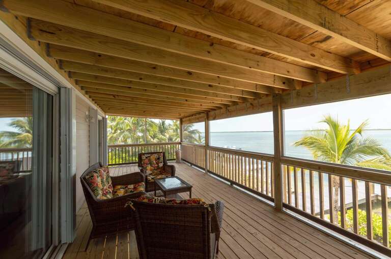 Beachfront Vacation Rental Balcony With Seating Overlooking The Ocean Beachfront Vacation Rental Balcony With Seating Overlooking The Ocean