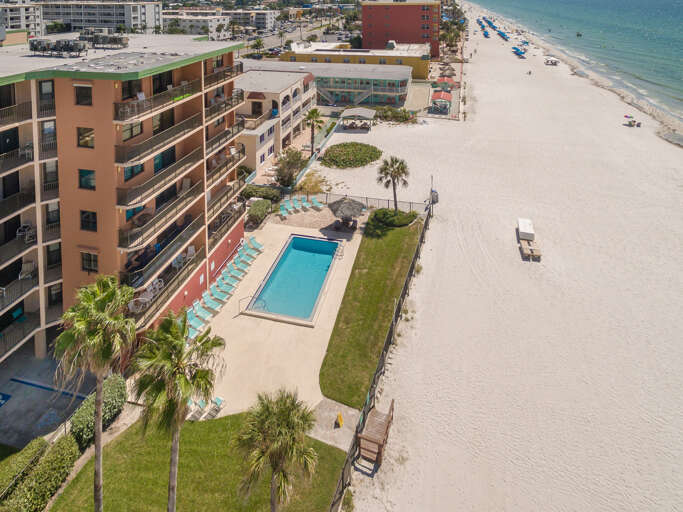 Beachfront property with pool and direct beach access on pristine sandy shores.