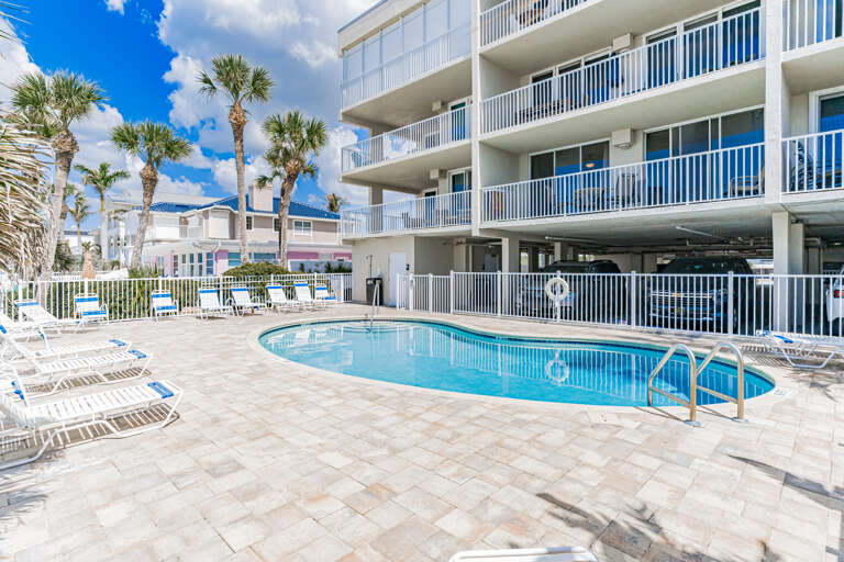 Dive into crystal-clear waters while tropical palms sway overhead. Your perfect pool day awaits with plenty of lounge chairs and Florida sunshine.