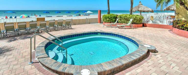 Dive into your private beachfront oasis with this sparkling pool just steps from pristine white sand and turquoise waters.