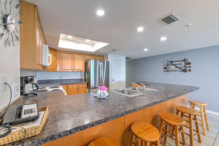 Cook memorable meals in your spacious granite-topped kitchen, complete with modern appliances and cozy breakfast bar seating.