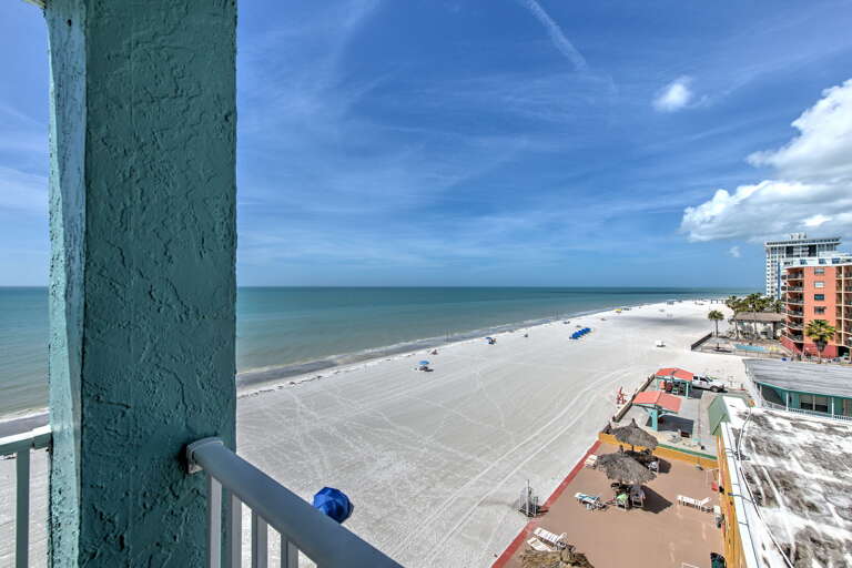 Wake up to stunning beachfront views from your private balcony, where endless white sand meets azure waters in perfect harmony.